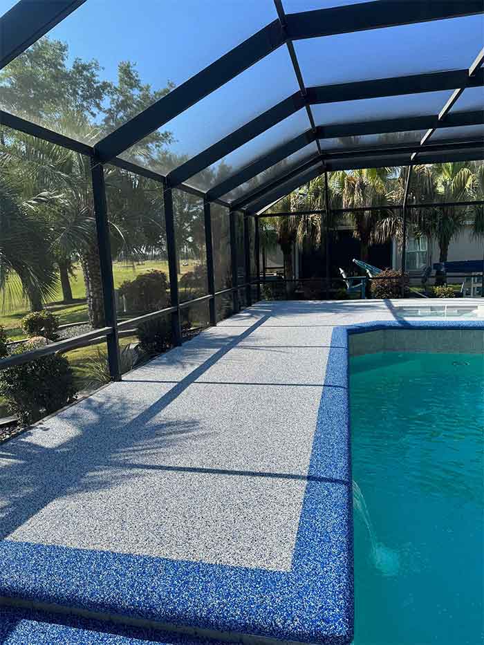 Rubber pool deck resurfacing installation in Florida